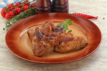 Roasted chicken wings with spicy sauce