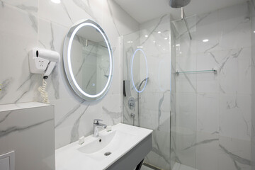 Iinterior of a modern hotel bathroom with shower cabin