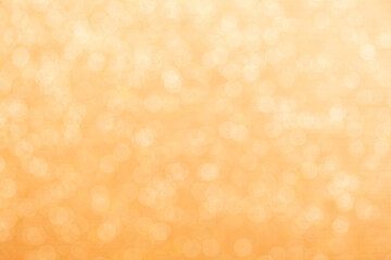 Gold light shiny bokeh abstract blur background with bright round defocus golden pattern