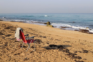 Fototapeta na wymiar Chair for relaxing in a cafe on the Mediterranean coast