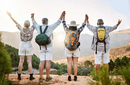 Celebrating Freedom, Fun And Hiking With A Group Of Senior Friends Taking A Mountain Hike And Enjoying The View. Rearview Of Retired Friends Spending Time Together And Bonding In The Forest Or Woods