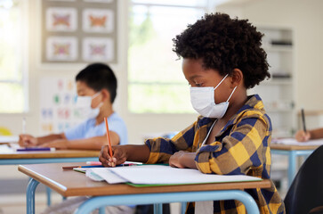 School student in class during covid pandemic for learning, education and study with mask for...