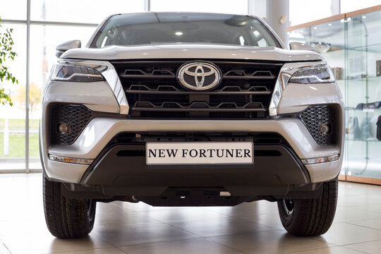 Russia, Izhevsk - September 30, 2021: Toyota showroom. New modern off-road Fortuner in dealer showroom. Front view. Famous world brand.