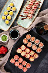 different rolls on beautiful plates with napkins top view composition