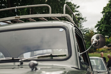 Fototapeta na wymiar Vintage car with side mirror and luggage rack