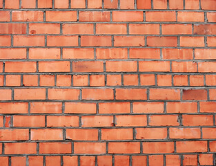 Texture of a red brick wall, building background