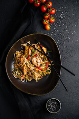 Fried noodles with chicken and vegetables. chicken chow mein.