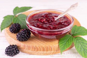 Blackberry jam in a glass bowl.Close-up.
