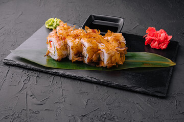 Sushi bonito roll on a dark background