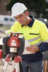 worker in front of a measure instrument computer on site