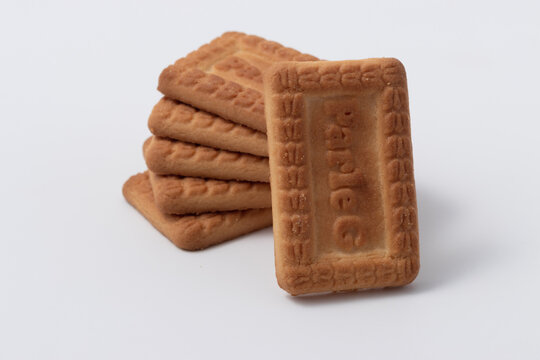 Ghaziabad, Utter Pardesh , India - August 16 2022: Parle G biscuit, A picture of parle g biscuit stacked together isolated on white background