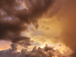 Beautiful sky with clouds in the golden light of the sun.
