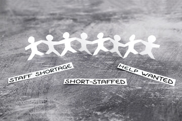 staff shortages and business struggling after the pandemic, peper people chain with text on gray...