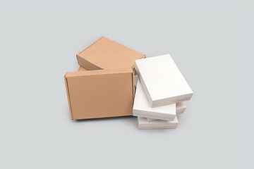 White and brown colored group of cardboard boxes isolated on white background. E-commerce and packing concept.