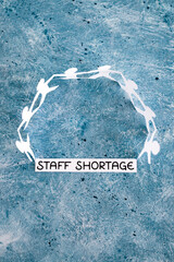 staff shortages and business struggling after the pandemic, peper people chain with text on blue...