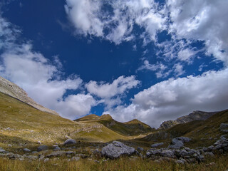 Summer view of Val Chiarino with blue sky and clouds in Abruzzo Italy