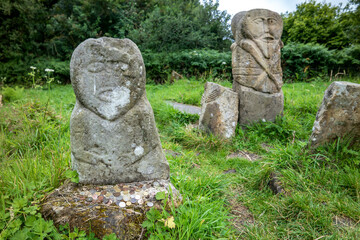 This is a bronze age stone carviing with two faces,called Janus, located In Caldragh Cemetery on Boa Island, Lower Lough Erne. Northern Ireland