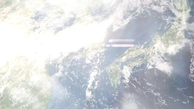 Earth zoom in from outer space to city. Zooming on Tongyeong, South Korea. The animation continues by zoom out through clouds and atmosphere into space. Images from NASA