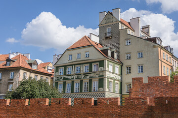 Historical wall and tenements in Old Town of Warsaw city, Poland