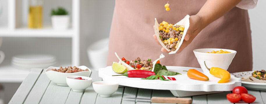 Woman Making Tasty Tacos In Kitchen, Closeup