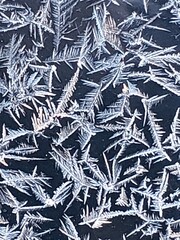 frost snowflake patterns on window