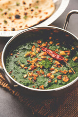 lasooni palak recipe or dhaba style garlic spinach curry, Indian main course served with naan