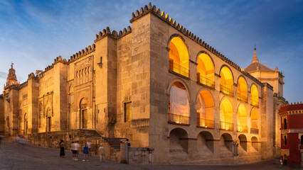 Mezquita street view at sunset. The Mosque–Cathedral of Córdoba is an Unesco world heritage site. Cordoba, Andalusia, Spain. Long exposure photography. 