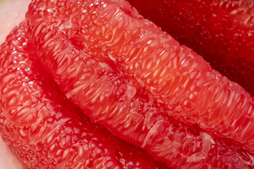 Close up, Red Pomelo or Siam ruby pomelo,Top view of many pieces of peeled Red Pomelo or grape fruit.