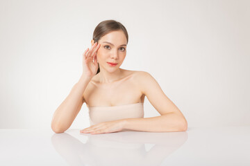 Beautiful young asian woman with clean, fresh and healthy smooth fair skin