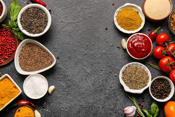 Composition with fresh aromatic spices on dark background
