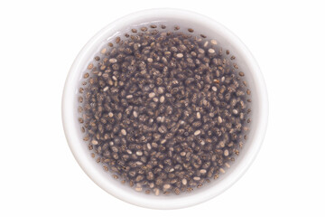 Chia seeds soaked in a small white cup