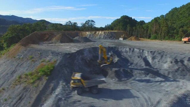 Industrial landscape with large granite quarry in the woodland aerial view