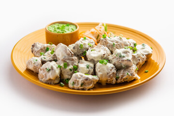 vegetarian soya malai chap made using soya chaap with white creamy gravy