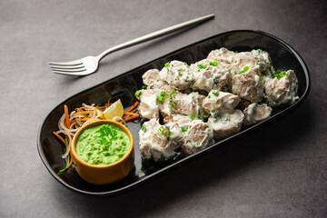 vegetarian soya malai chap made using soya chaap with white creamy gravy