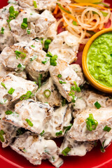 vegetarian soya malai chap made using soya chaap with white creamy gravy