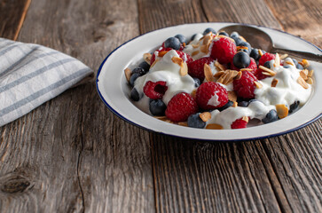 Yogurt with berries and roasted almonds