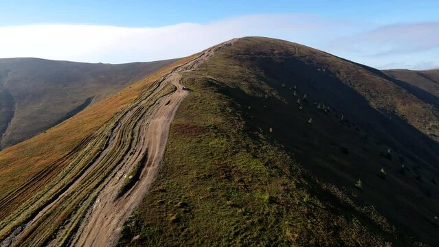 aerial view of trail road to the top of carpathian mountains