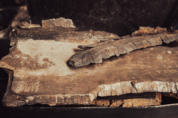 Rusty remnants of a military projectile. Military industry. Shell fragments. War in Ukraine. Iron debris. Remains of the rocket.