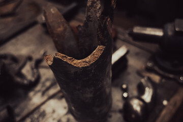 Rusty remnants of a military projectile. Military industry. Shell fragments. War in Ukraine. Iron debris. Remains of the rocket.