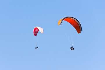 Fototapeta na wymiar Paragliders above the Chamonix Valley, Chamonix Mont-Blanc, France