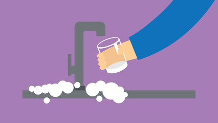 A hand with a glass draws water under the kitchen faucet