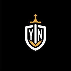 Creative letter YN logo gaming esport with shield and sword design ideas - obrazy, fototapety, plakaty