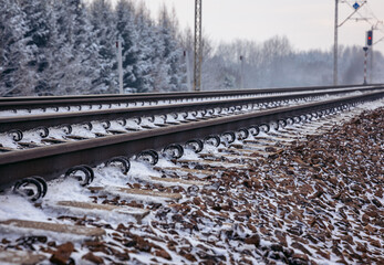 Railway tracks covered with snow in Rogow, Lodz Province, Poland