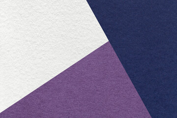 Fototapeta premium Texture of craft navy blue, white and lavender shade color paper background, macro. Vintage abstract indigo cardboard