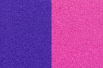 Fototapeta premium Texture of craft navy blue and purple paper background, half two colors, macro. Vintage dense magenta cardboard.