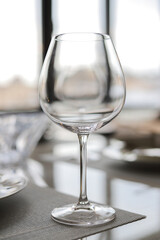Empty wine glass on a served table