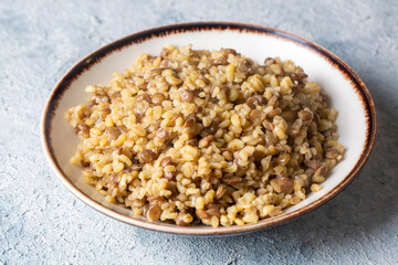 Traditional delicious Turkish foods; bulgur pilaf with green lentils (Turkish name; yesil mercimekli bulgur pilavi)