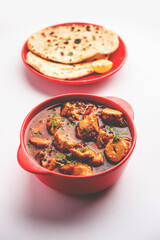 Punjabi soya chaap gravy or dhaba style soya chap masala sabzi served with naan