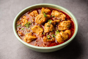 Punjabi soya chaap gravy or dhaba style soya chap masala sabzi served with naan