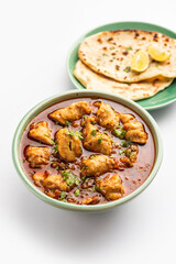 Punjabi soya chaap gravy or dhaba style soya chap masala sabzi served with naan